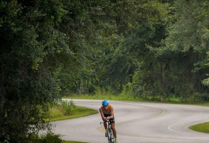 Cyclist on winding road in Clermont, FL