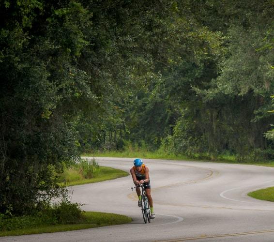 Cyclist on winding road in Clermont, FL