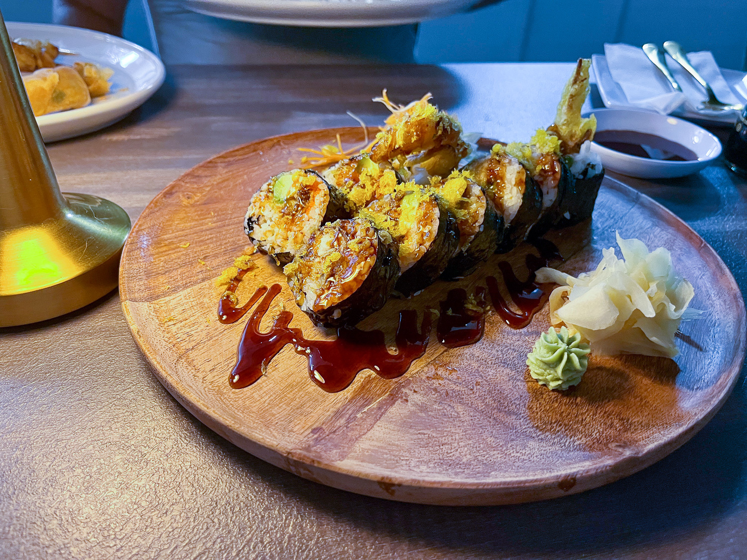 Sushi spider roll on a wooden plate