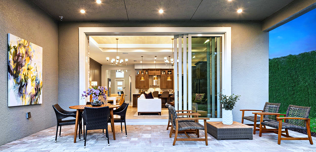 A view into a residence from a covered patio area.