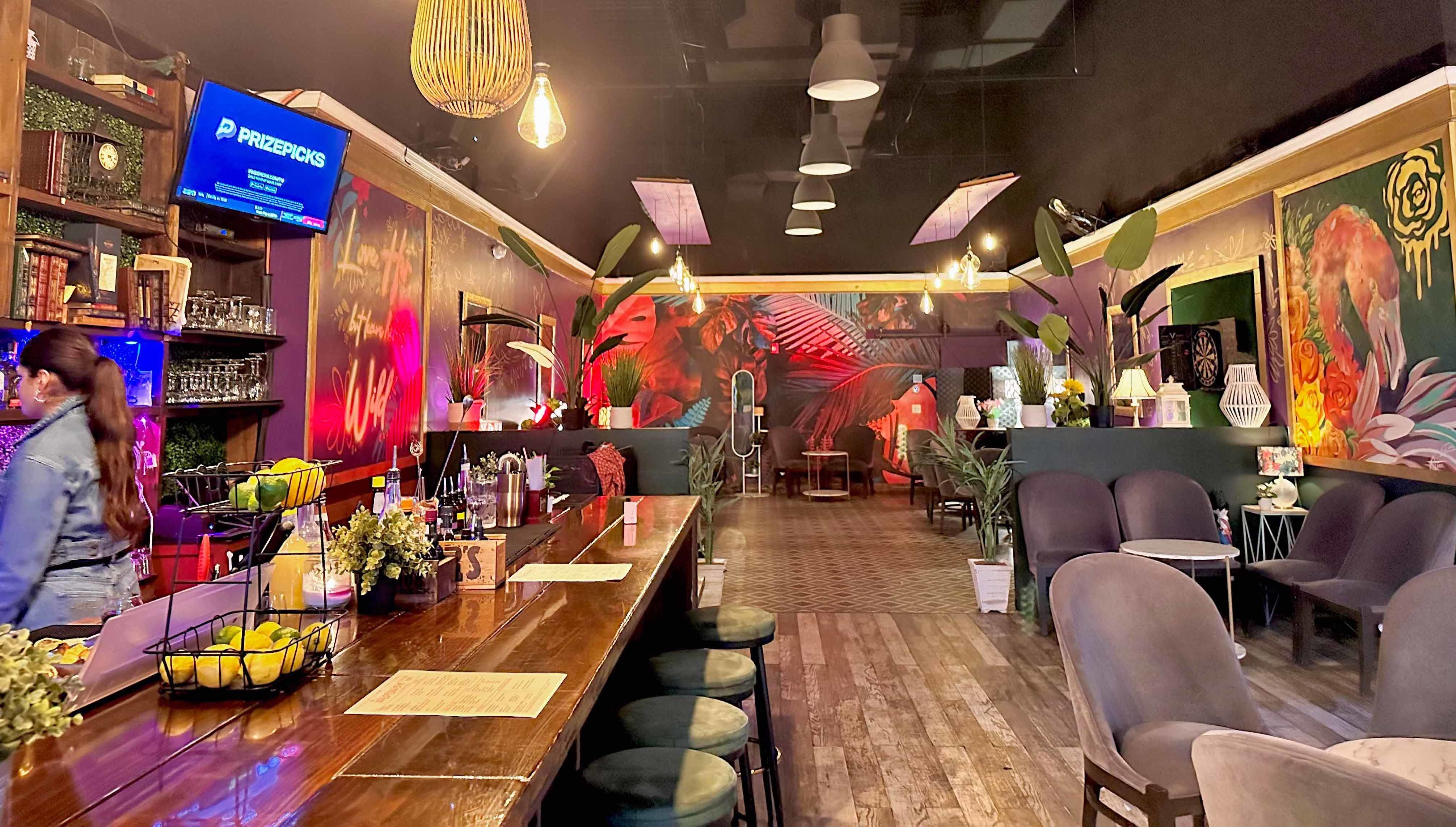 inside wildflower bar with colorful decor and hanging lights