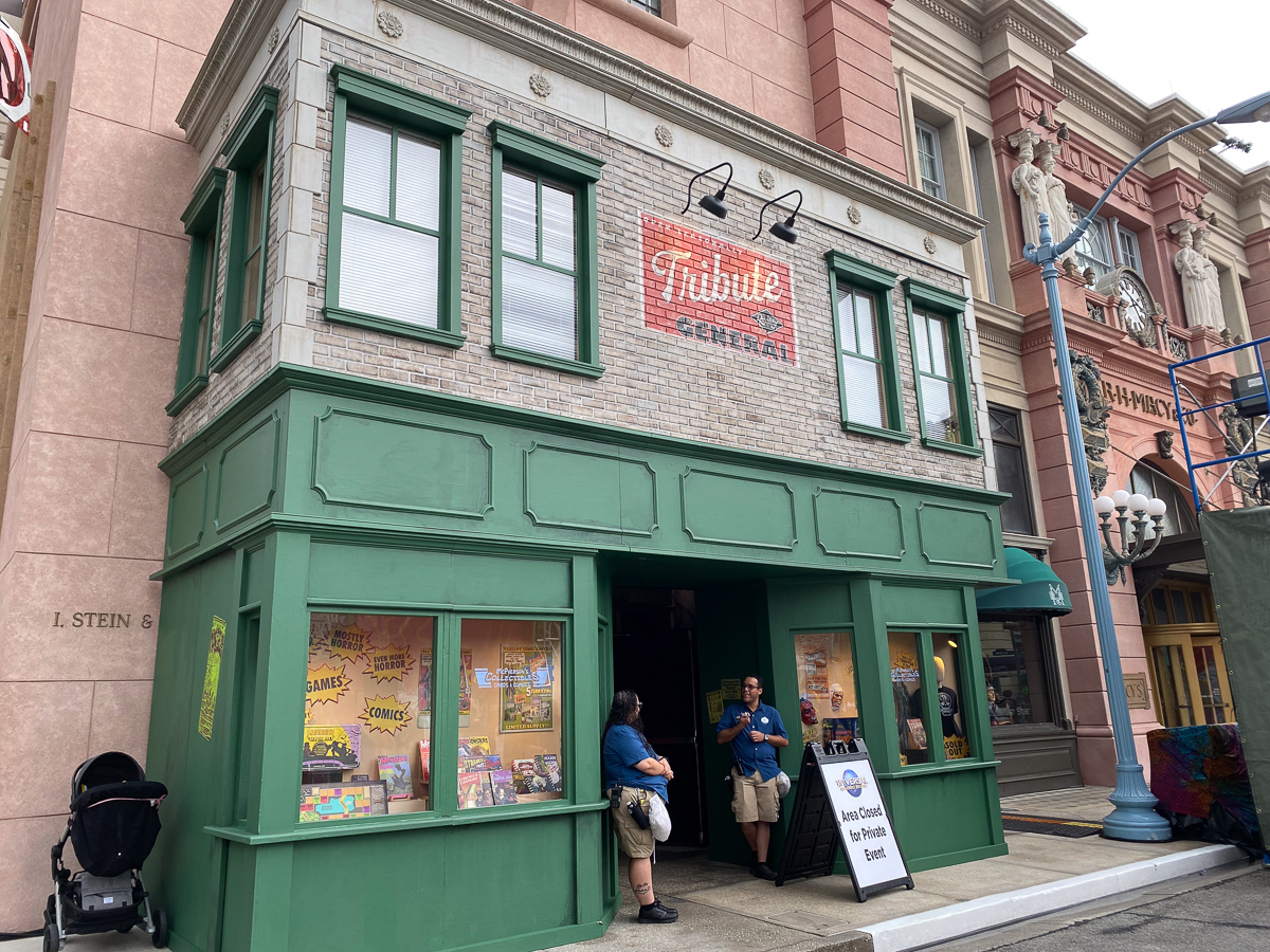 front of tribute store building with green paint