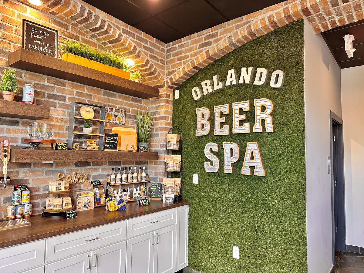 corner of the beer spa with sign on greenery wall and other products 