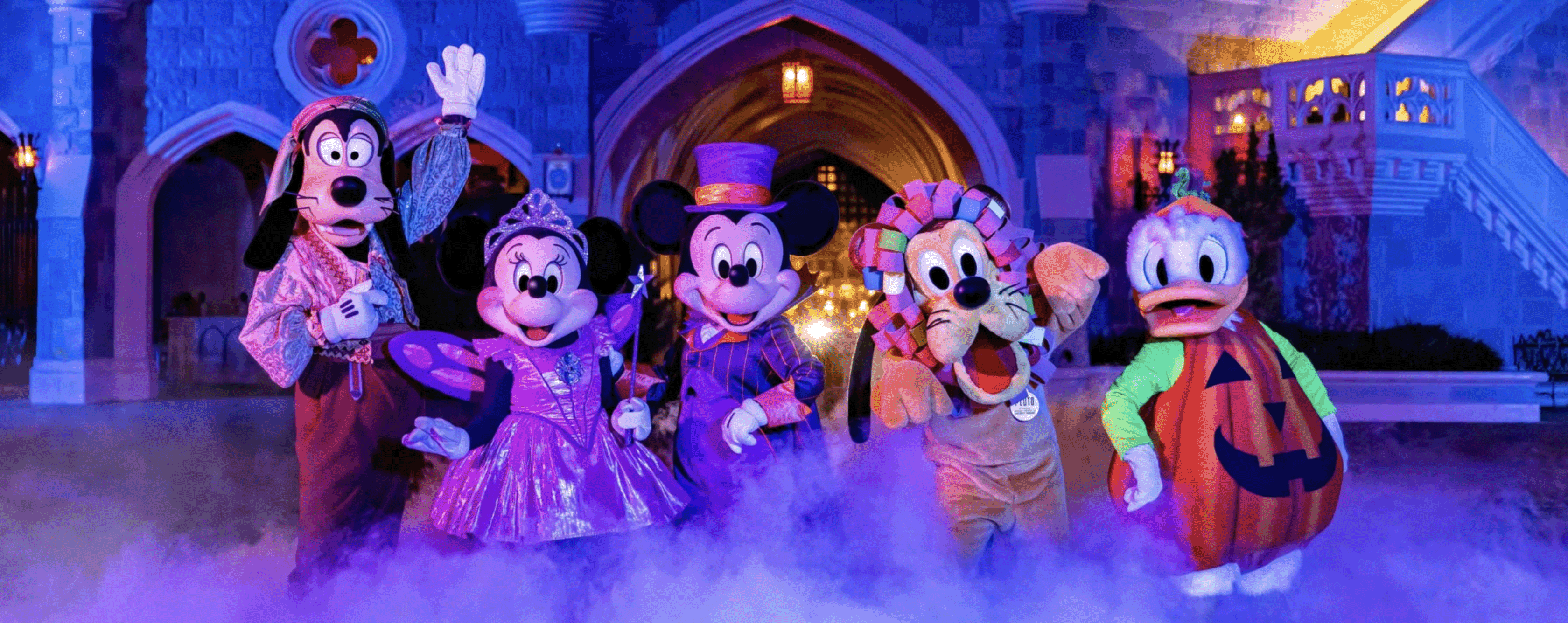 mickey mouse and friends in halloween costumes