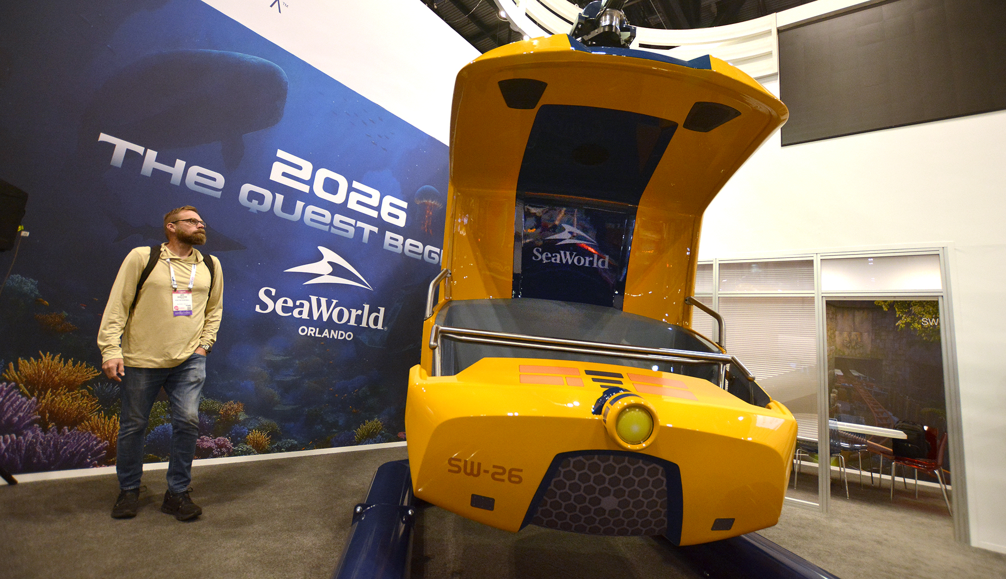 An IAAPA guest checks out SeaWorld Orlando's SEAQuest ride vehicle.