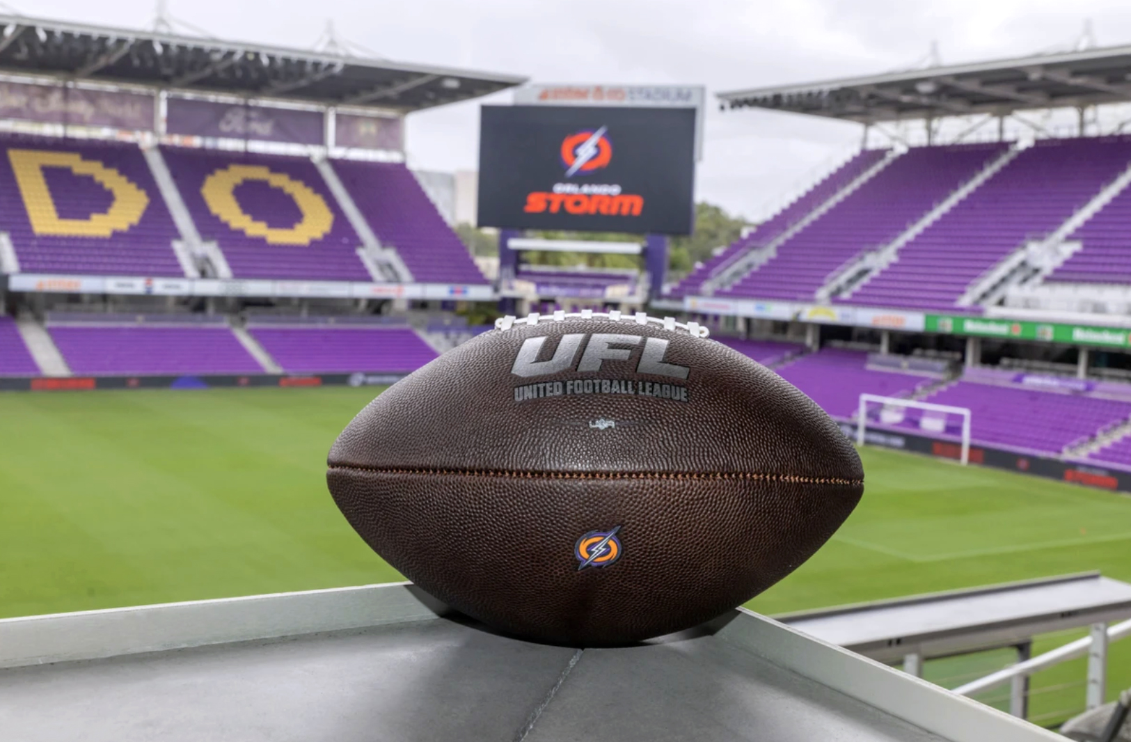 A UFL football with Inter&Co Stadium in the background