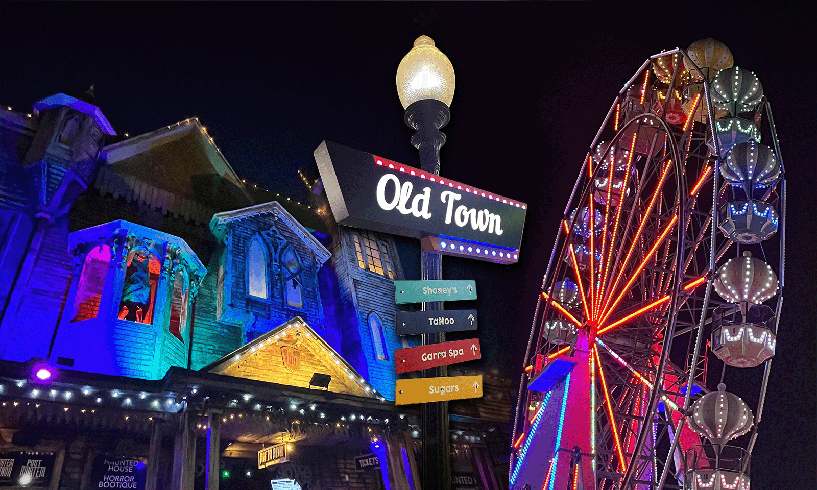 black background with bright neon lights on a mansion and ferris wheel with old town sign