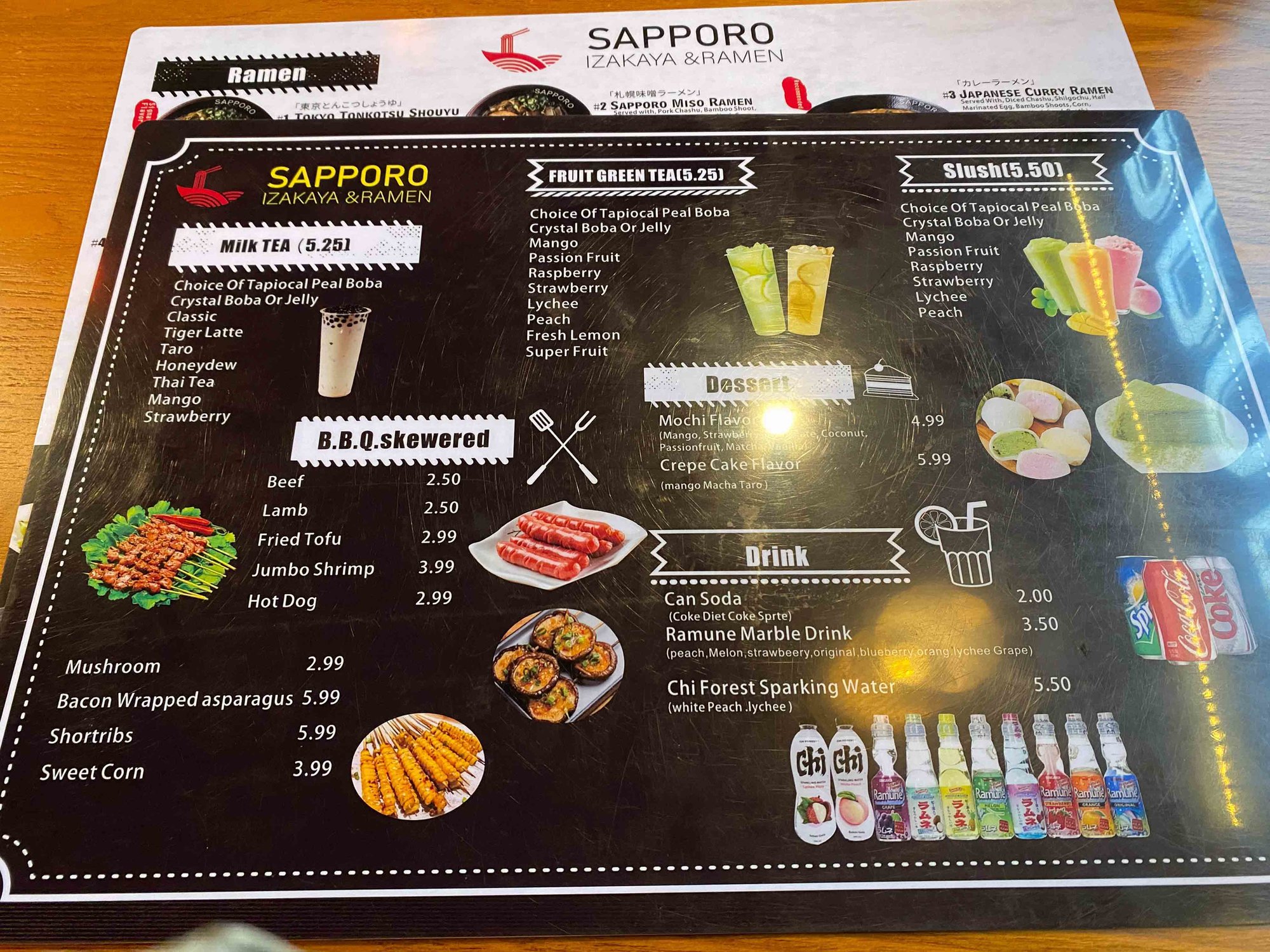 black menu with pictures and menu items