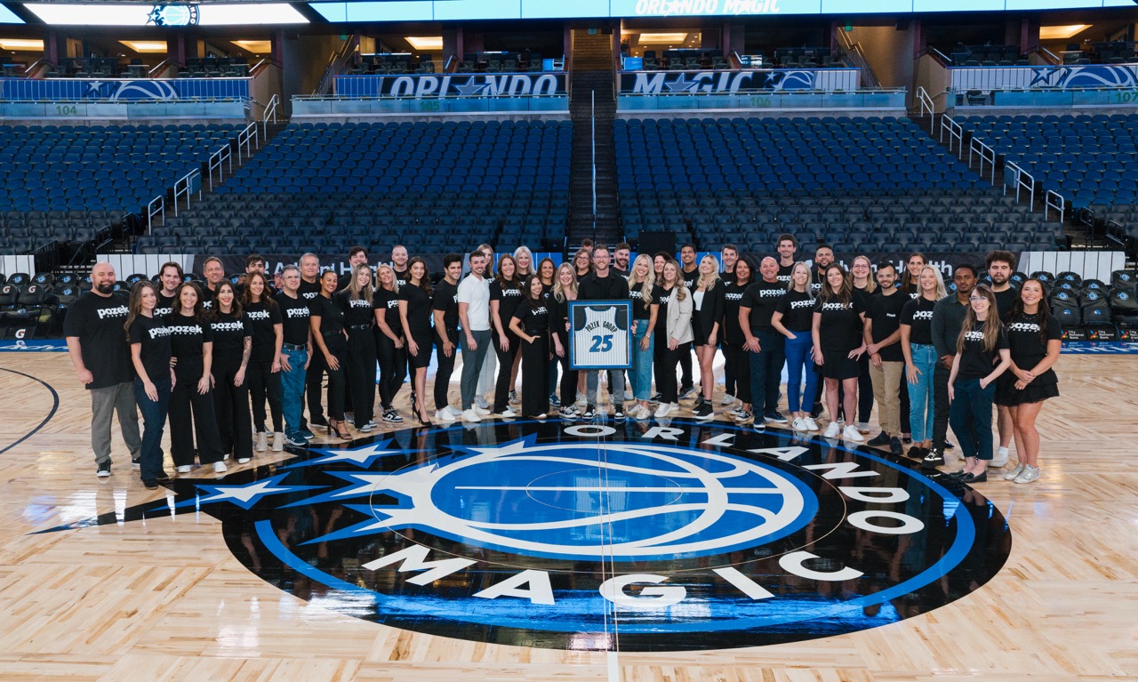 The Pozek Group on the Orlando Magic court at the Kia Center in 2025