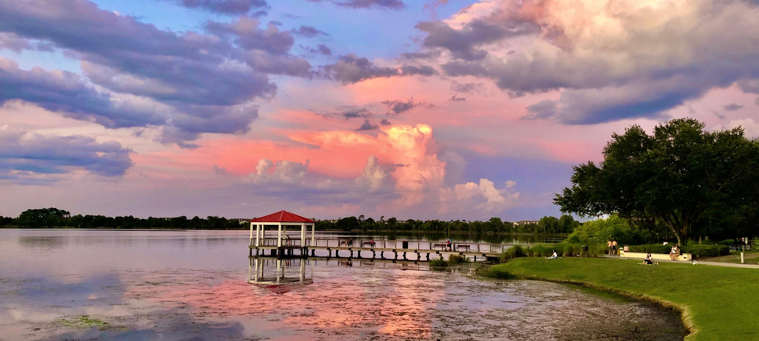 Sunset over gazebo and pier at Lake Baldwin in Baldwin Park, Orlando