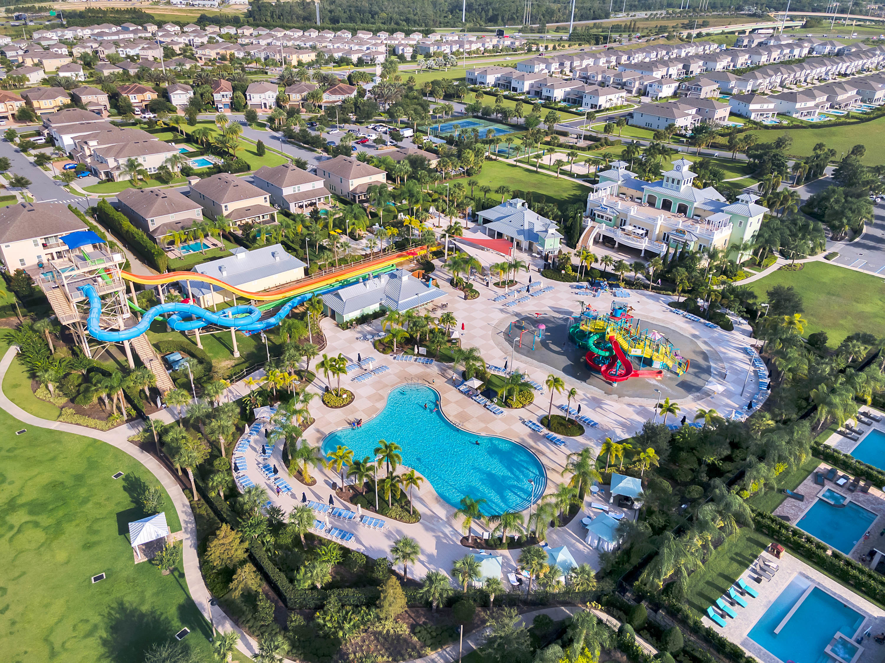 drone shot of encore at reunion resort with water park and homes