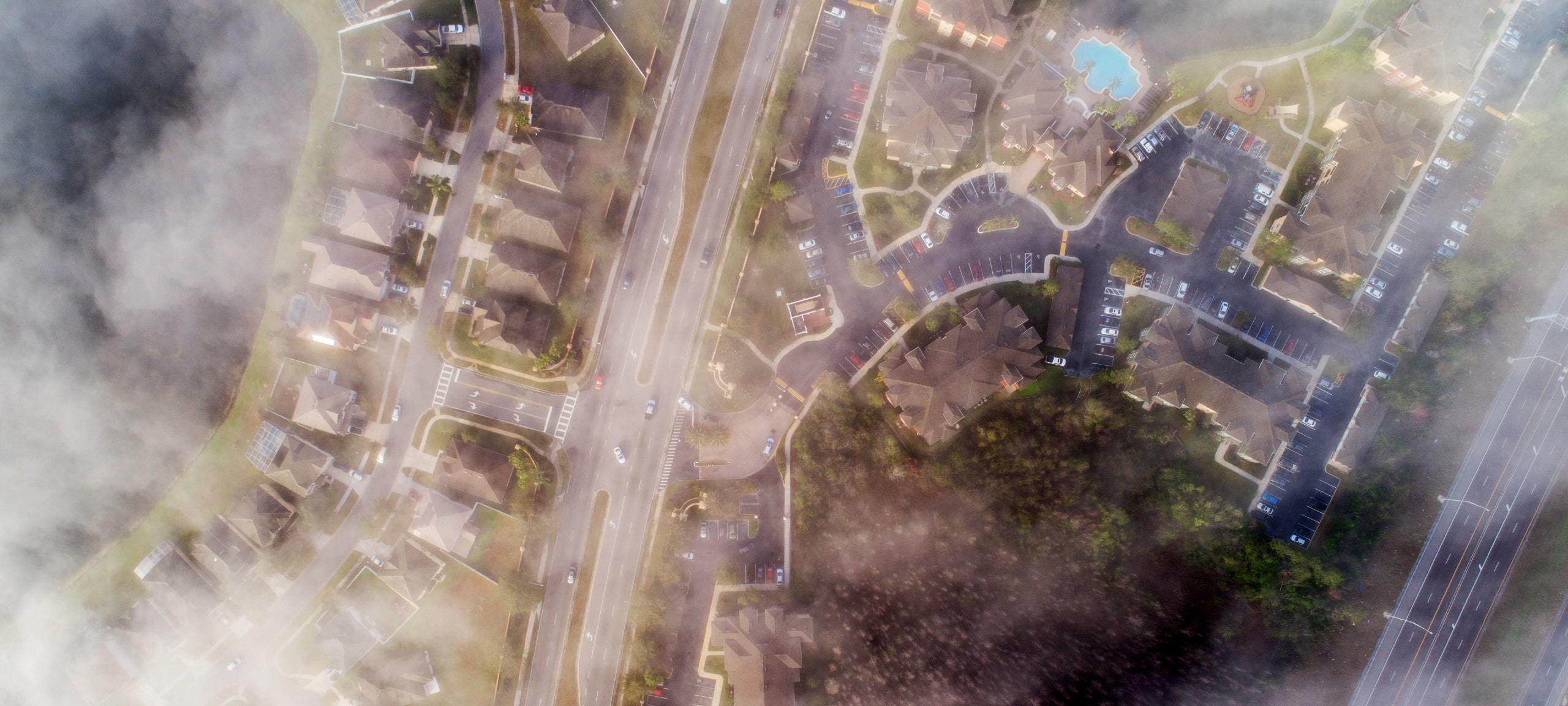 Foggy aerial view over homes in Hunters Creek, Florida