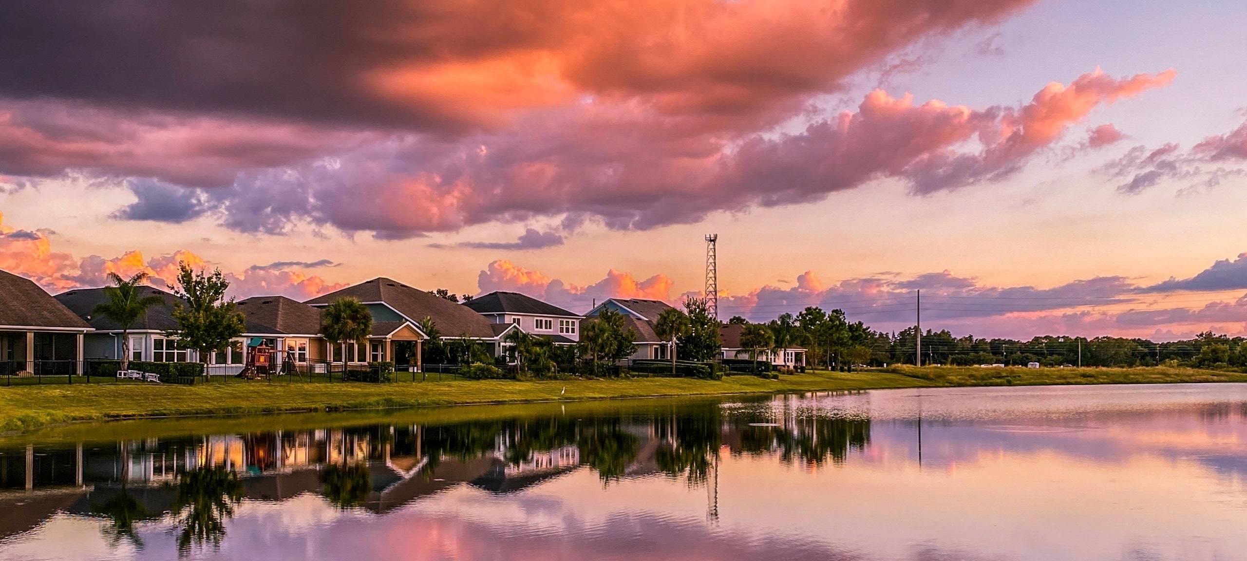 Vibrant sunset over row of waterfront homes, Orlando, FL