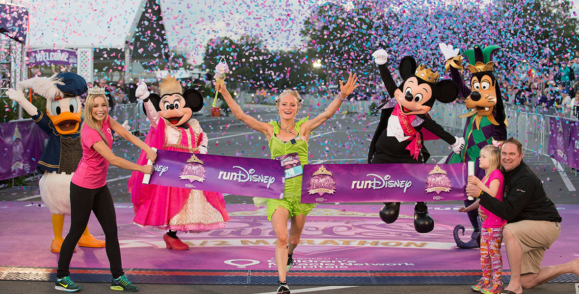 Disney Marathon runner winning first place with confetti